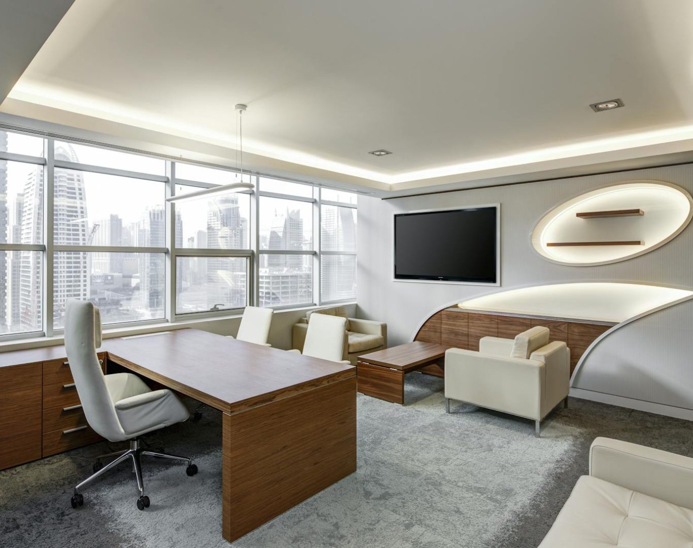 Sleek office space featuring contemporary furniture and city skyline views, ideal for professionals.